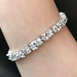 18kwgp oval cut topaz tennis bracelet.
